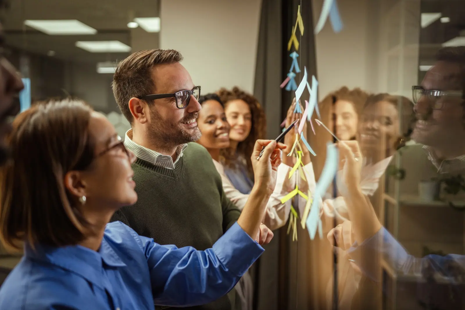 People collaborating around a table during a working session